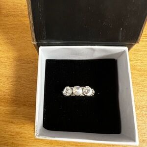 Three rhinestone silver tone engagement ringSize 7